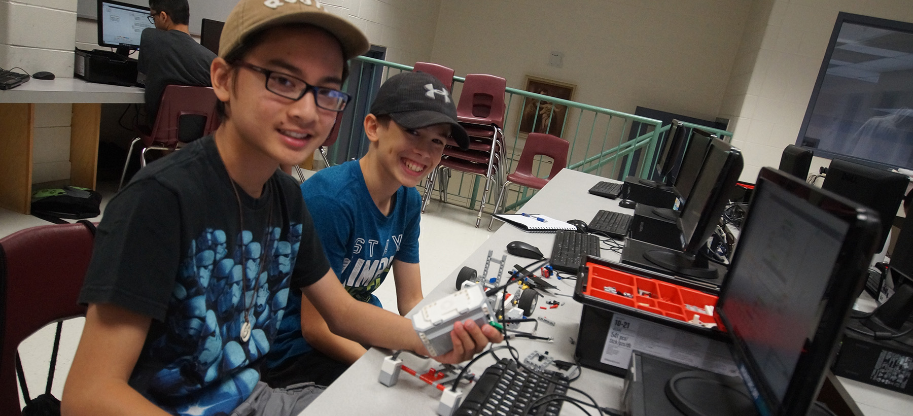 Two male students on a computer