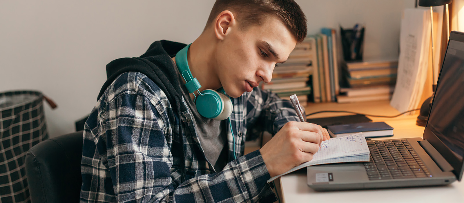 Male student working at a desk