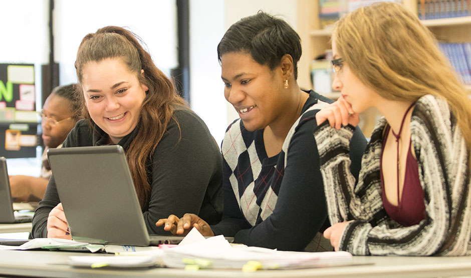 Students working together at the computer