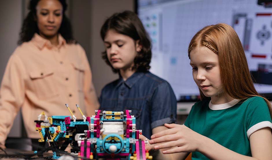 Two students working on robotics