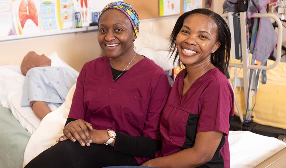 Two PSW students sitting together