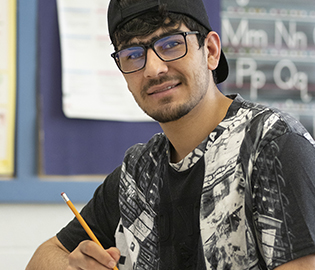 Male student at a white board