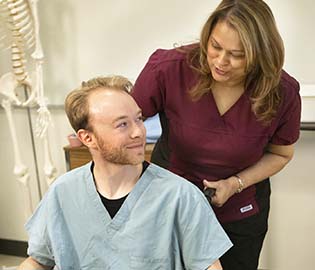 Students working together in a PSW class