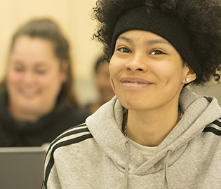 Student smiling at the camera