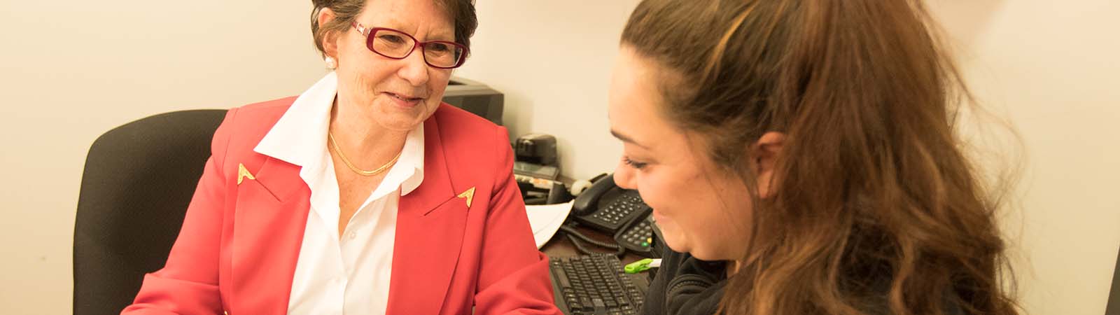 Correspondence Coordinator working with a student