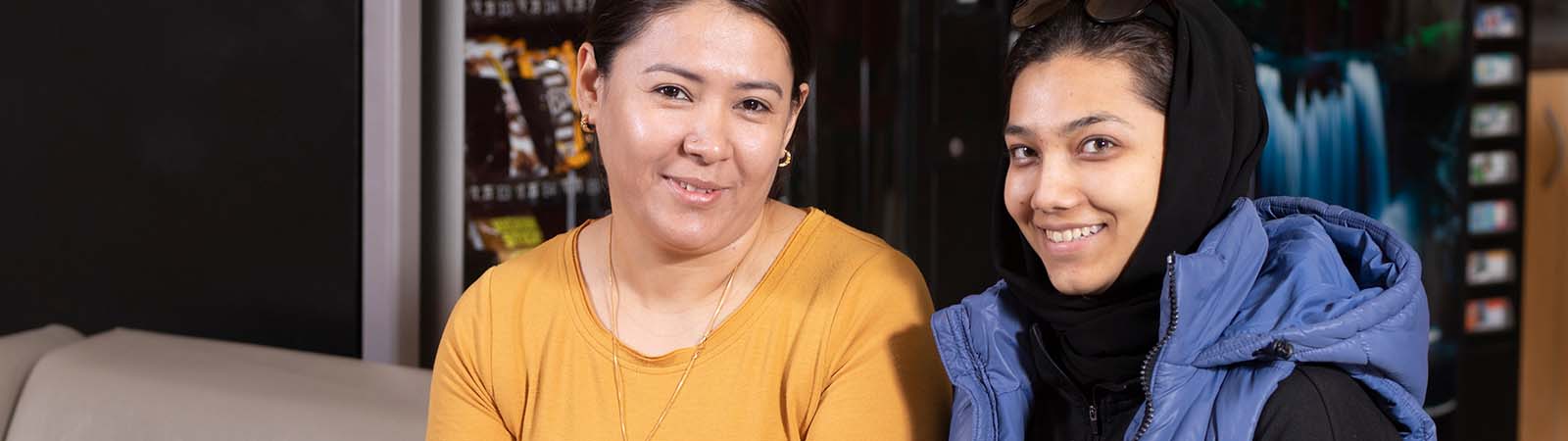 Two students smiling