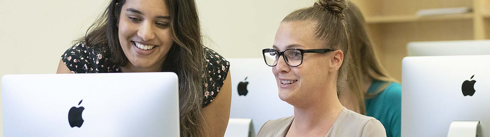 teacher helping a student register