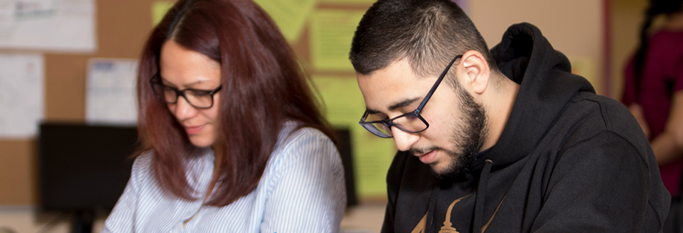 Two students writing a test